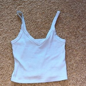 Cropped. Light material. Never worn except trying on. A little loose.